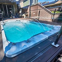 hydropool swim spa in a garage
